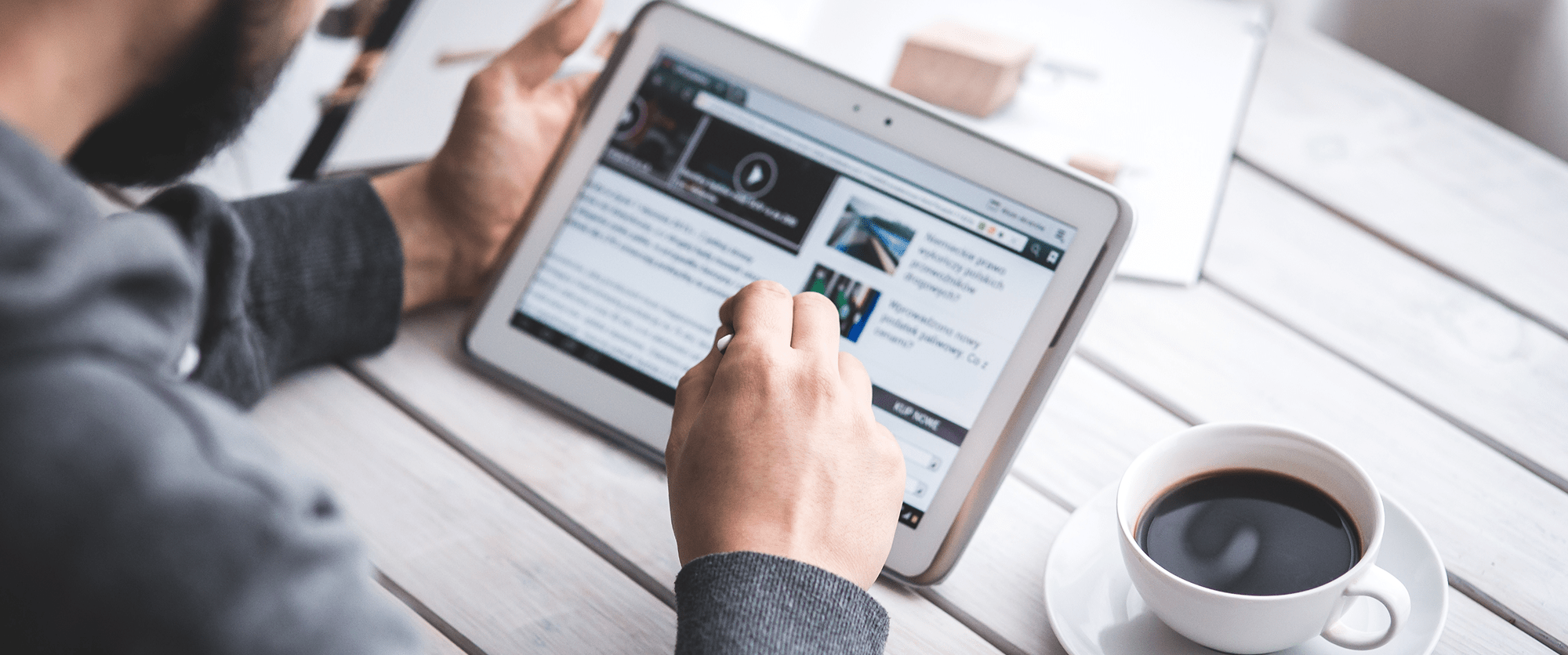worker-reading-news-with-tablet 1-min